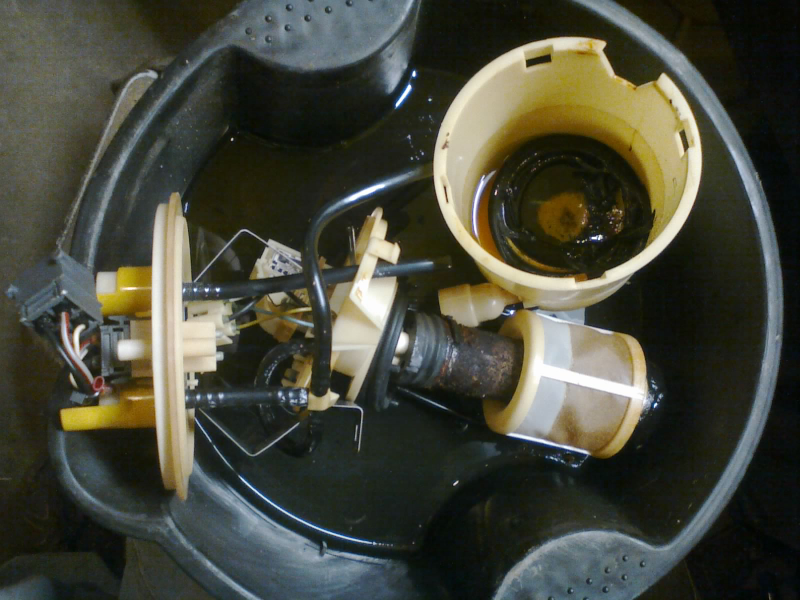 Pump assembly partially disassembled for a better view. NOT PICTURED: the rusty float arm